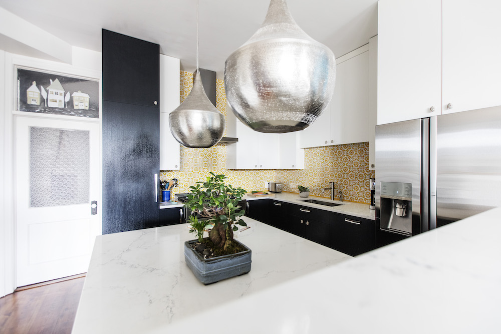 Large silver pendant lighting over counter