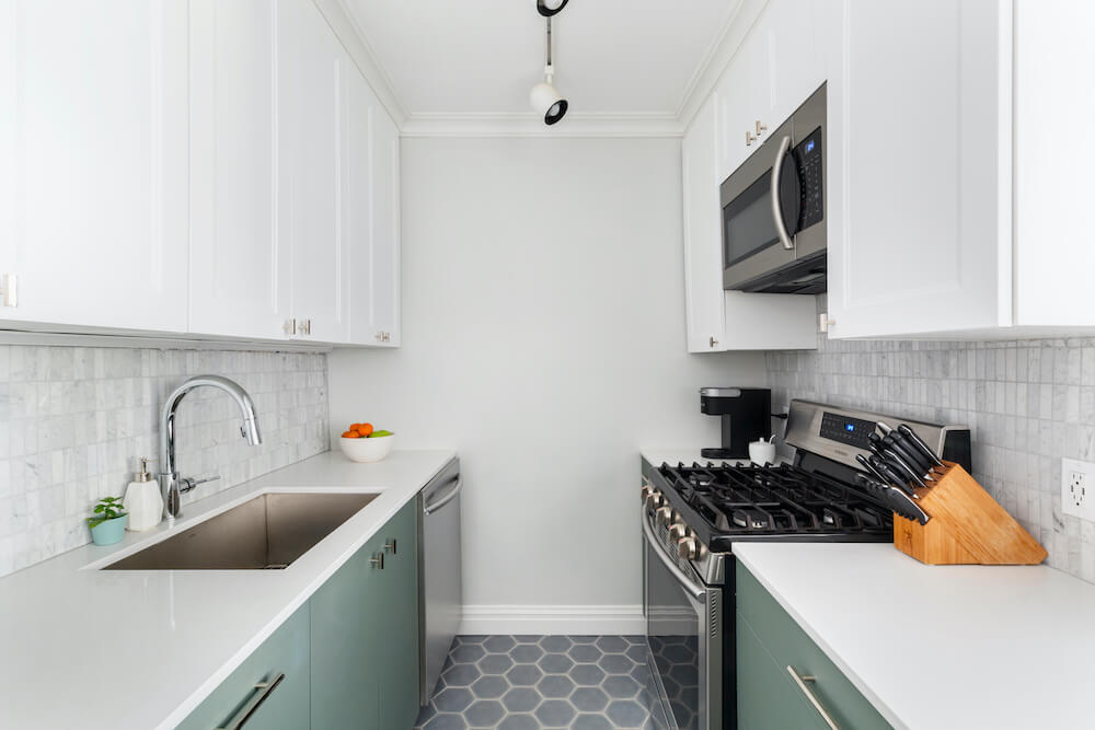 sage green kitchen two tone cabinets