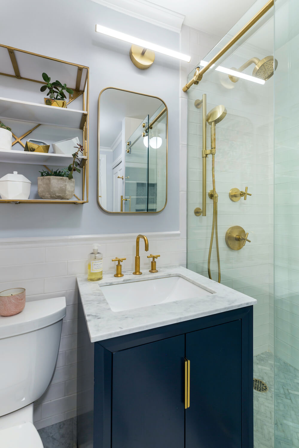 Blue cabinets and marble for bathroom vanity