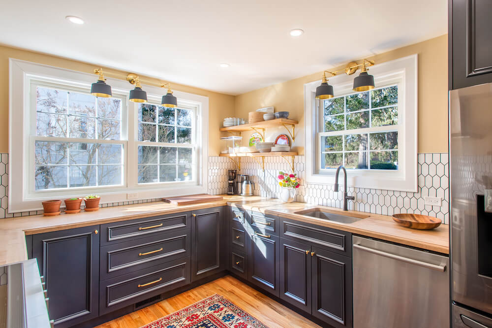 black kitchen cabinets and maple countertops