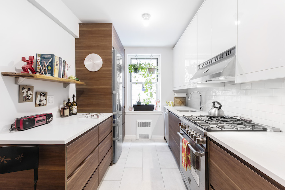 White and dark wood galley kitchen