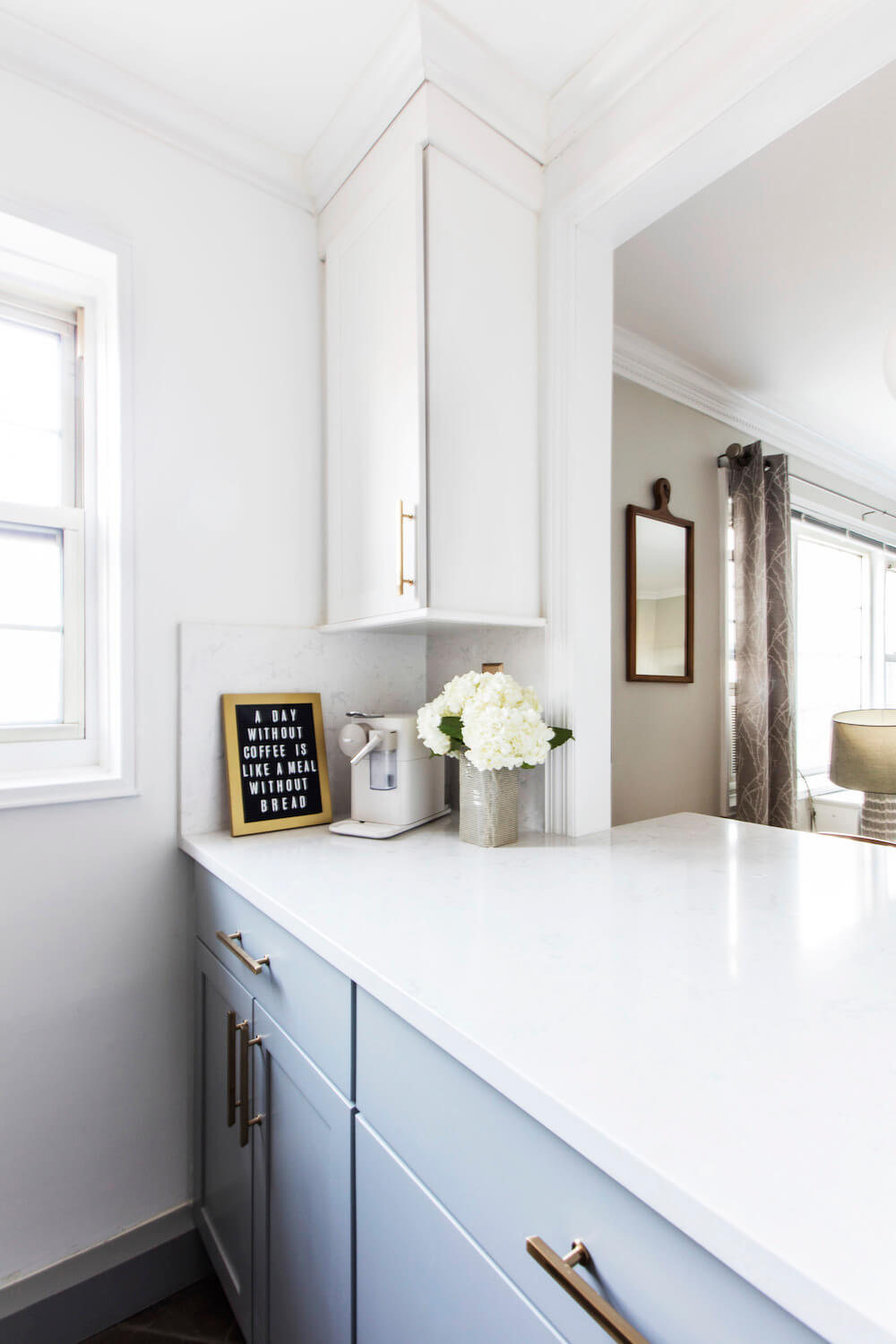 Kitchen with blue cabinets and white countertop