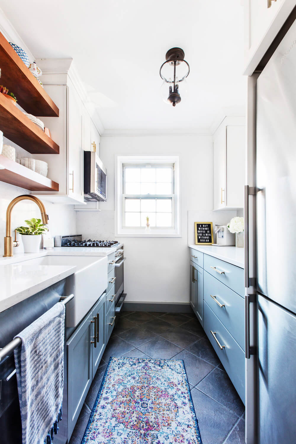 Galley kitchen with two tone cabinets