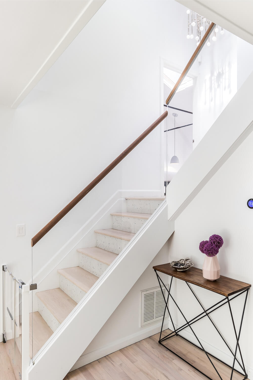Child-friendly staircase with glass and wood railing