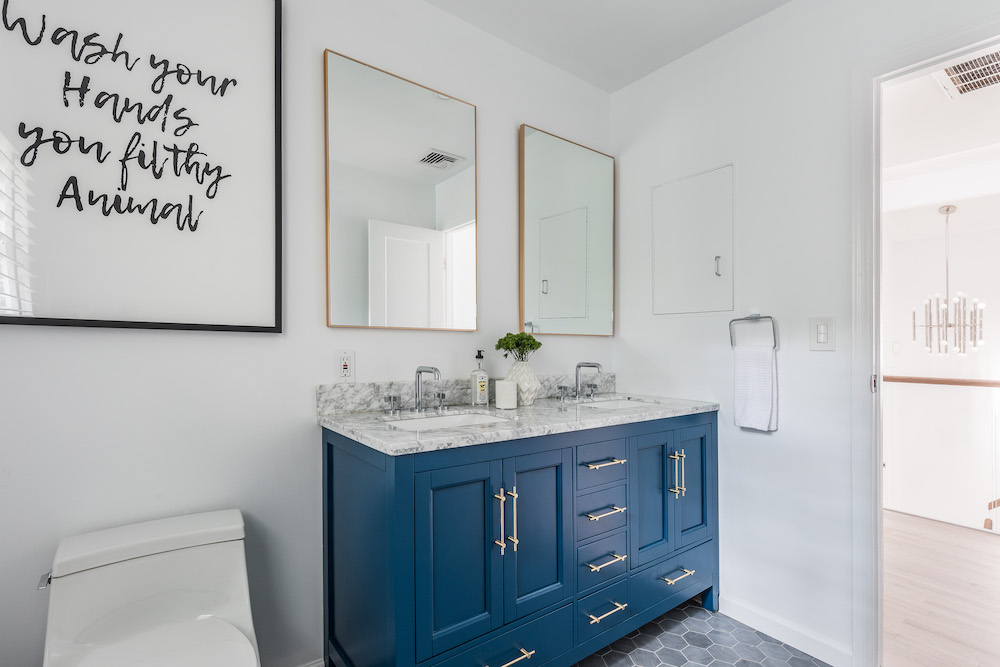 Bathroom with blue and marble vanity