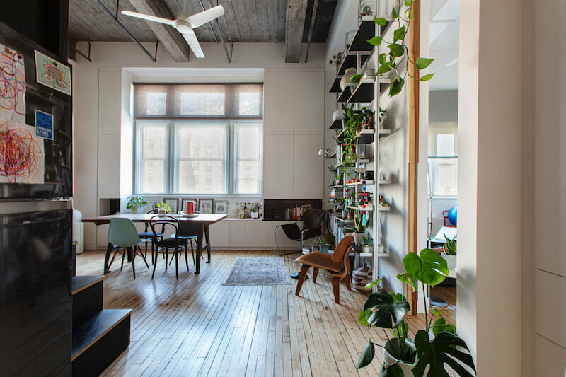 Apartment with hardwood floors with Dining area with open shelving unit after renovation