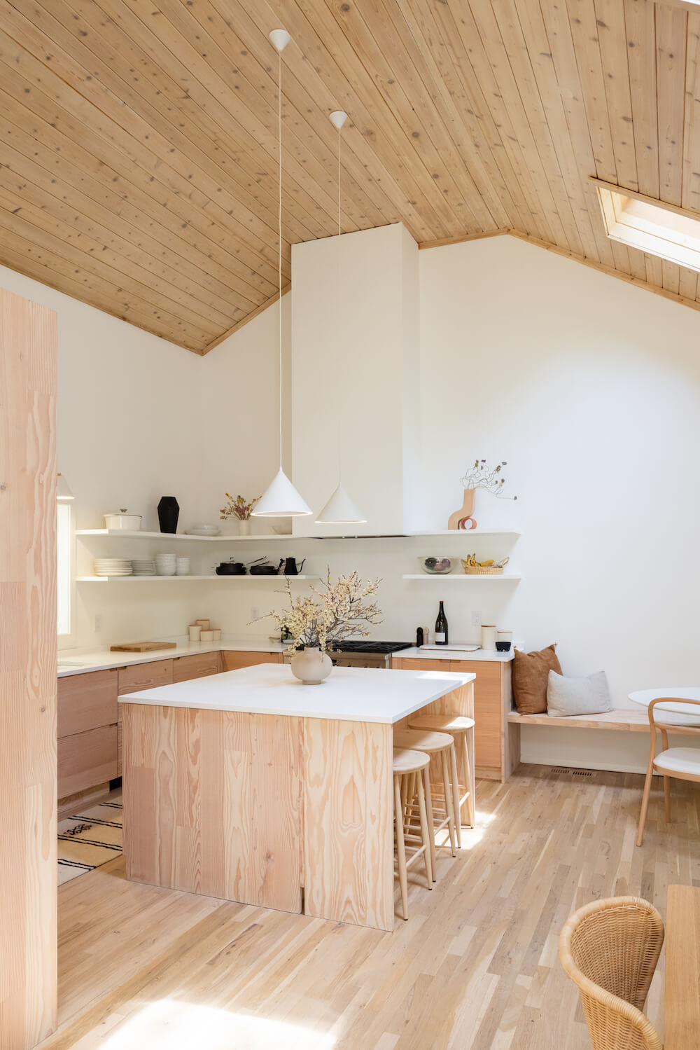 natural wood Kitchen cabinets with island and raw wood ceilings
