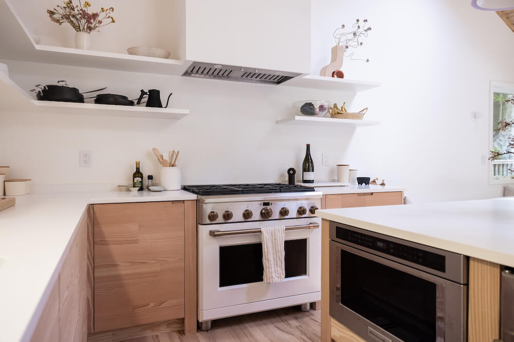 natural wood Kitchen cabinets and white range