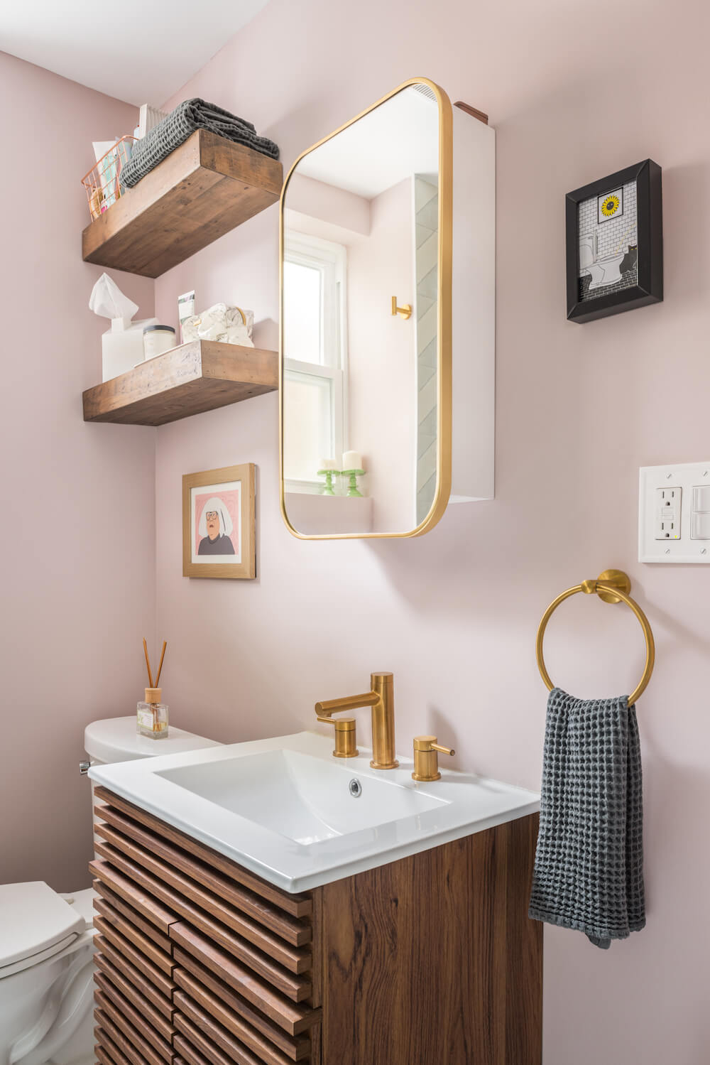 Wood vanity with mirror and gold hardware