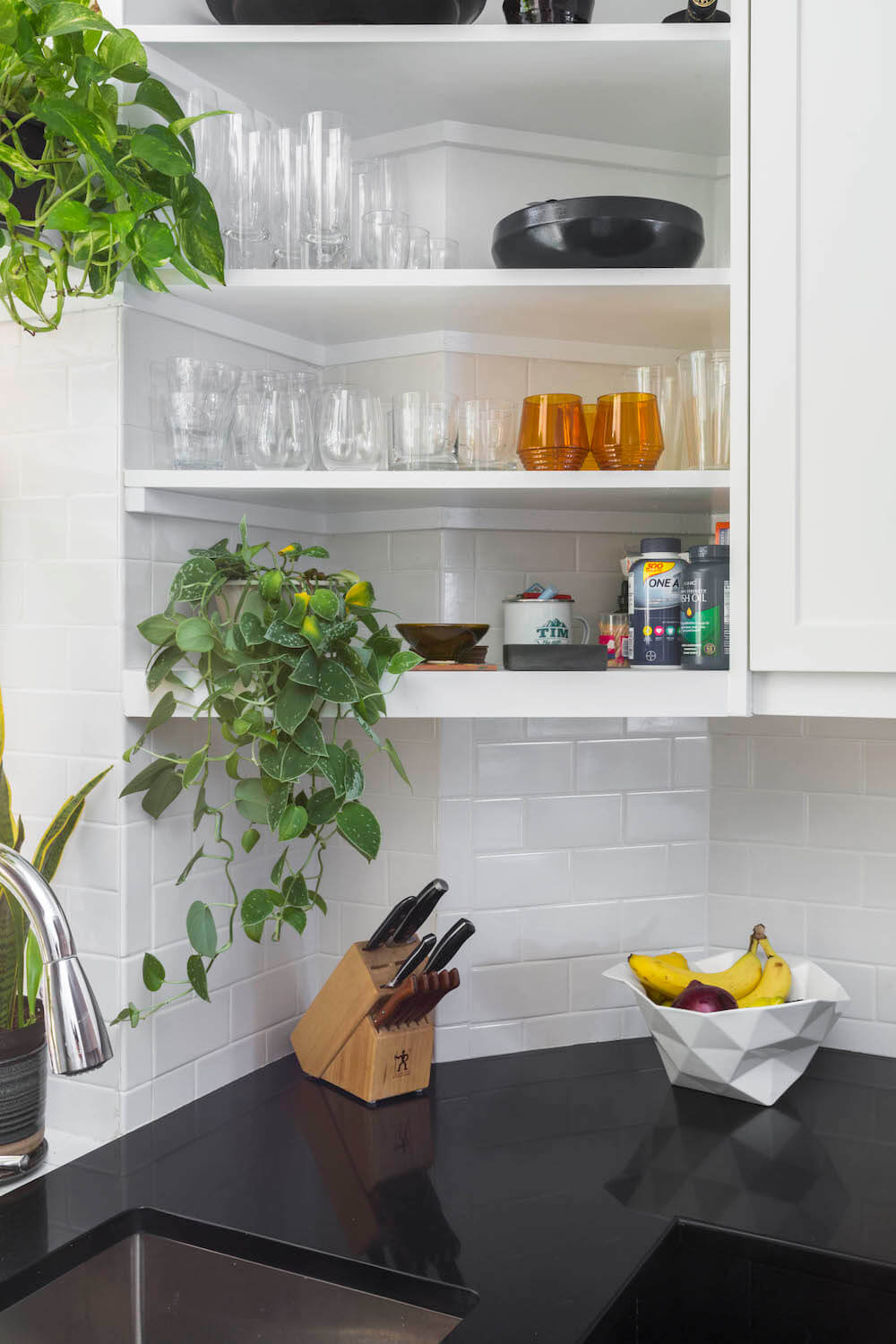 White subway tile backsplash and open shelving