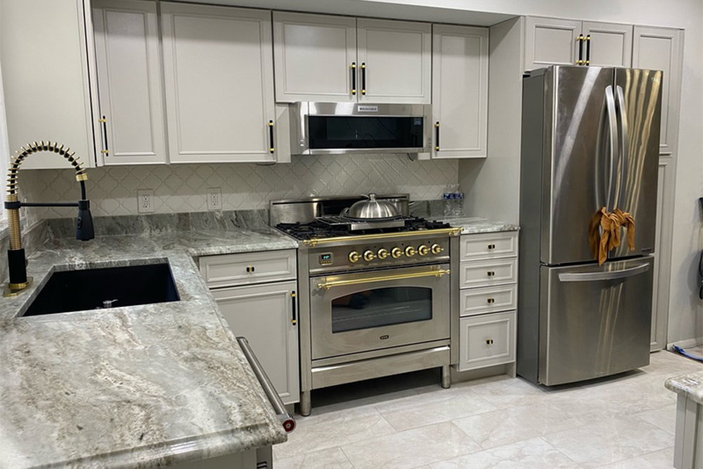 Kitchen with marble countertops and light gray countertops