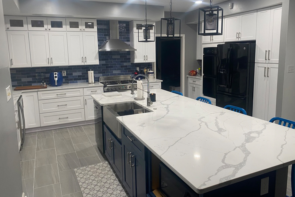 Kitchen with large island and white marble counter