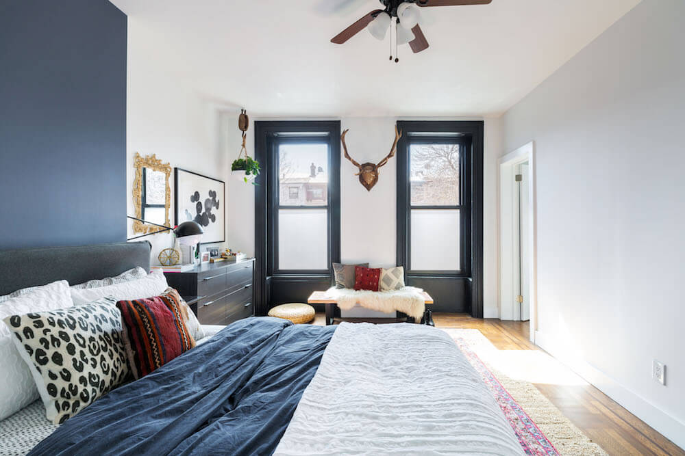 brownstone bedroom with black framed windows