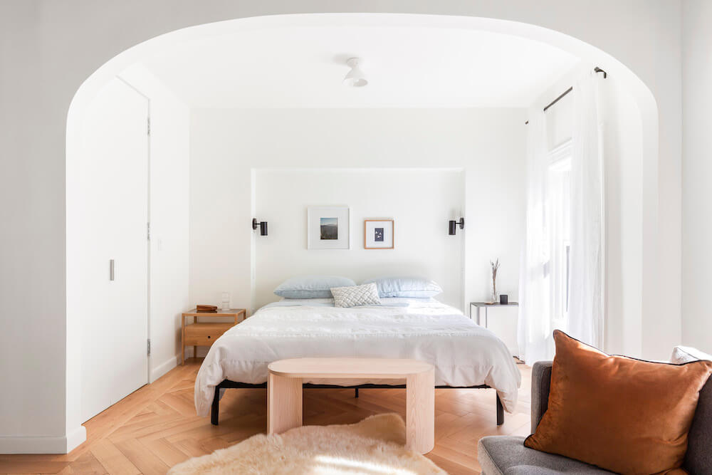 Alcove bedroom with archway and recessed wall