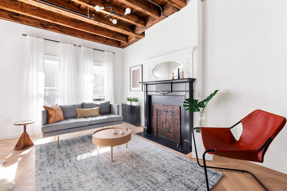 Brownstone remodel with fireplace and exposed beams
