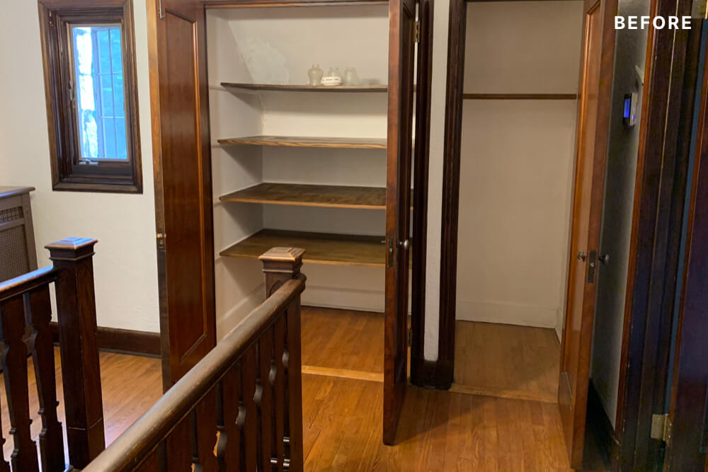 staircase rails in a landing area with hardwood floors storage closets and window before renovation