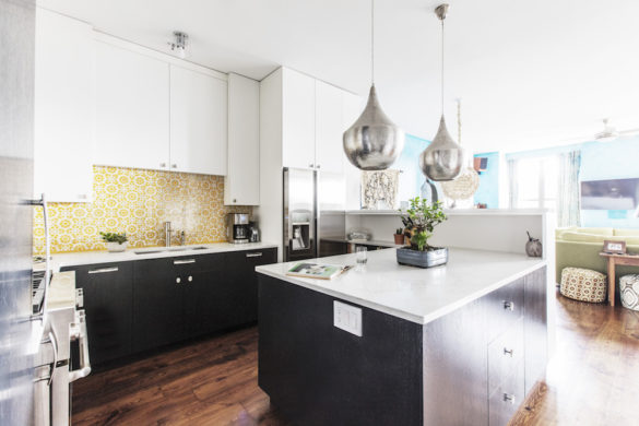 yellow Moroccan tile backsplash with dark brown and white cabinets