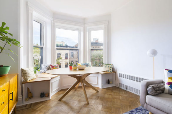 Living room with banquette and bay windows