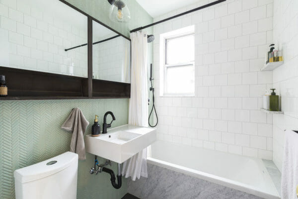 Green Herringbone Tile Shines in a Bath Remodel