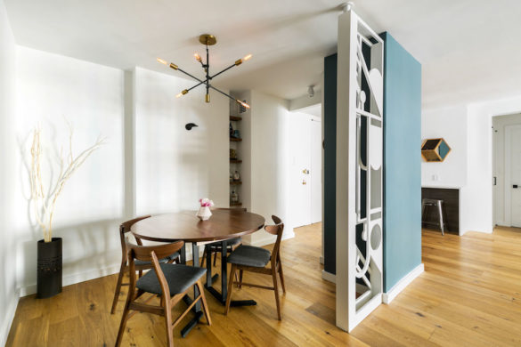 brown wooden floor for breakfast nook and living room with blue wall separator after renovation